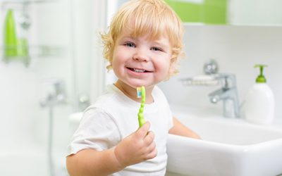 What kind of toothbrush and toothpaste should my child use?