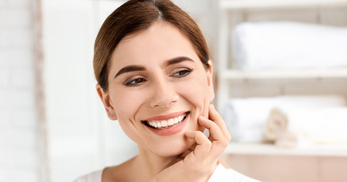 Young,Woman,With,Beautiful,Smile,Indoors.,Teeth,Whitening